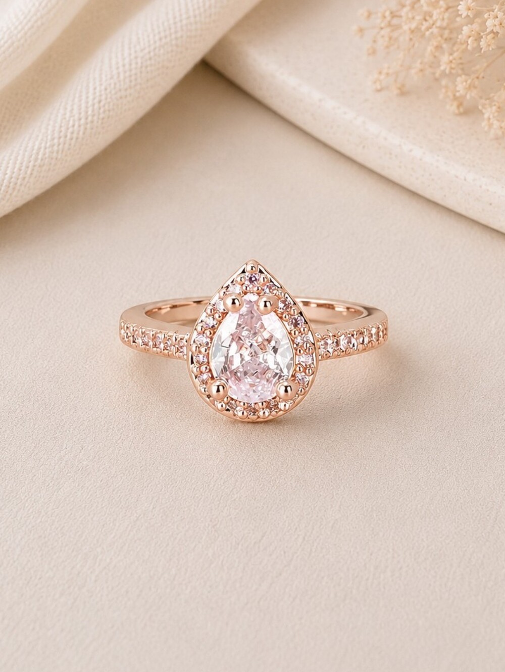 Rose Gold Pear Halo Ring with Pink Center Stone